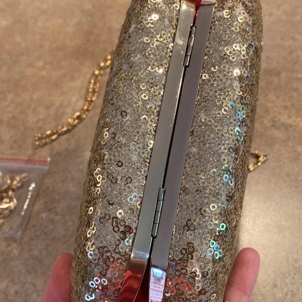 Womens gold clutch purse you can have the chain strap or tuck inside